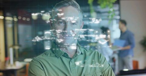 Businessman Analyzing Holographic Technology in Modern Office Setting