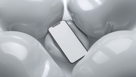 Modern Smartphone Resting Elegantly Among Glossy White Shapes