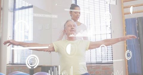 Senior man practicing balance with therapist in rehabilitation studio using digital overlay