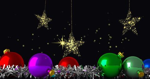 Colorful Christmas Baubles and Golden Stars on Tinsel Garland