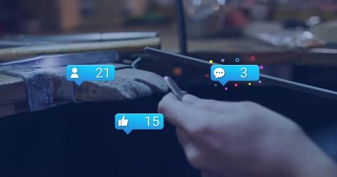 Artisan filing metal with social media interaction overlay