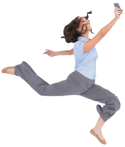 Joyful businesswoman jumping holding transparent smartphone