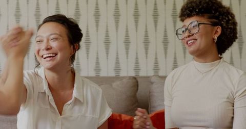 Diverse women collaborating on couch discourse