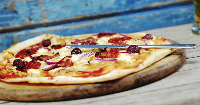 Freshly Baked Gourmet Pizza on Wooden Board - Download Free Stock Images Pikwizard.com