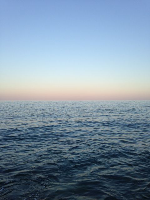 Calm Open Sea at Dusk with Clear Sky - Download Free Stock Photos Pikwizard.com