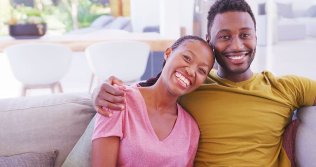 Portrait of happy african american couple embracing at home in slow motion. Domestic life, lifestyle and love.