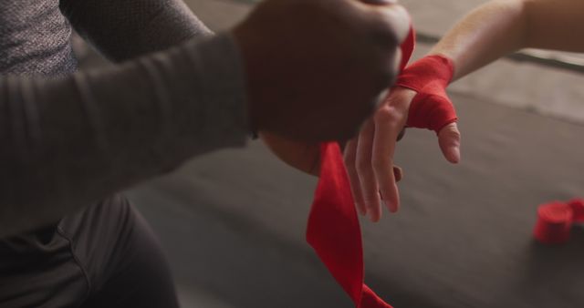 Trainer Wrapping Hands with Red Boxing Wraps for Workout Preparation - Download Free Stock Images Pikwizard.com