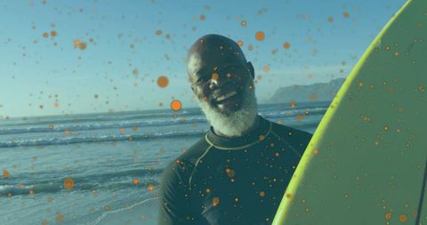 Man Surfing Shoreline Waves Holding Surfboard