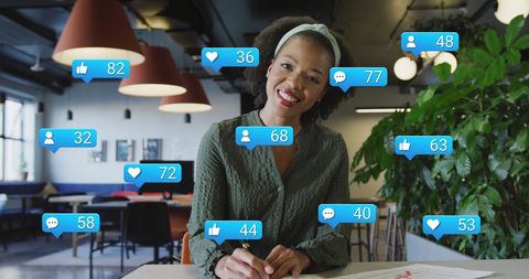 Engaging Woman Explaining Social Media Statistics in Modern Office