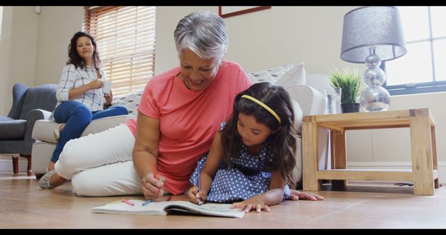 Family Time: Grandmother and Granddaughter Drawing Together in Living Room - Download Free Stock Images Pikwizard.com