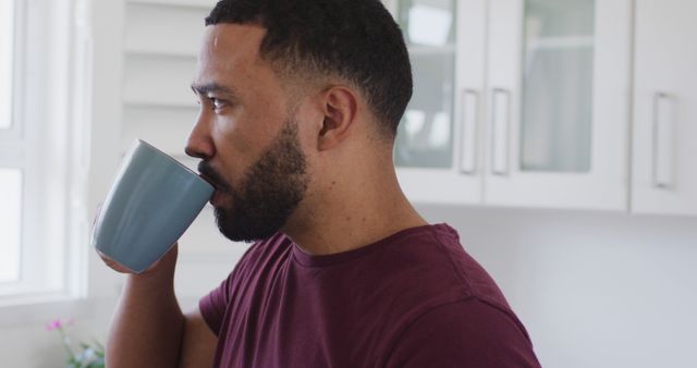 Man Drinking Coffee in Bright Modern Kitchen - Download Free Stock Images Pikwizard.com