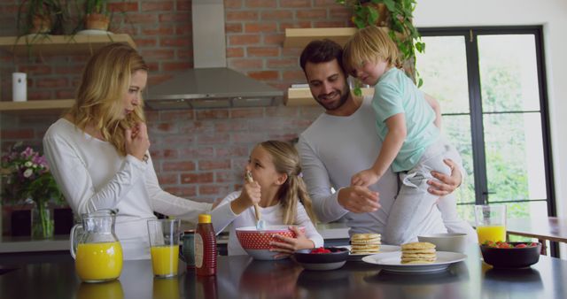 Happy Family Enjoying Healthy Breakfast Together in Modern Kitchen - Download Free Stock Images Pikwizard.com