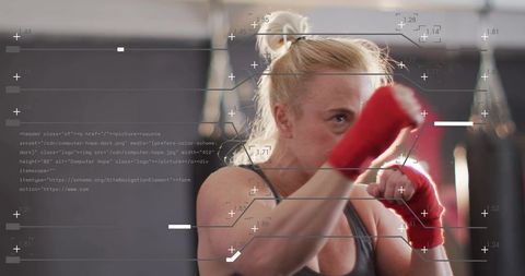 Female Boxer Punching in Gym With Red Hand Wraps and Futuristic HUD Performance Overlay