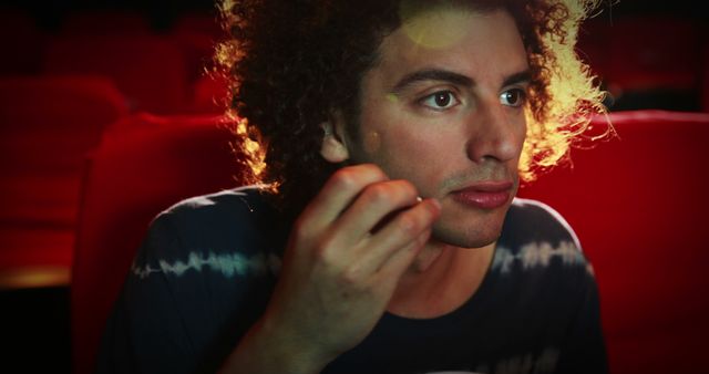 Captivated Young Man Watching Movie in Theater - Download Free Stock Images Pikwizard.com