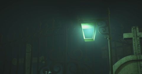 Eerie Cemetery with Green Lantern Lighting at Night - Download Free Stock Images Pikwizard.com