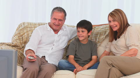 Happy Family Enjoying Movie Night at Home