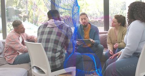 Team collaborating with tablet and blue data overlay in modern cozy lounge environment