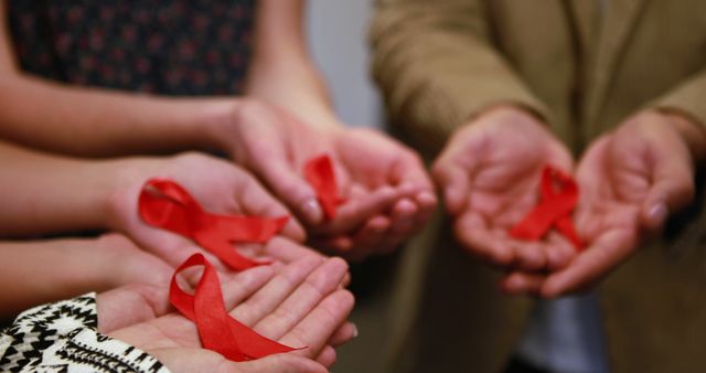 Group Holding Red Ribbons for AIDS Awareness and Support - Download Free Stock Images Pikwizard.com