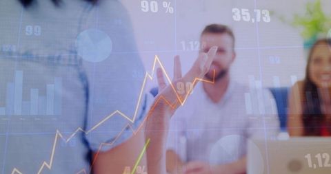 Presenting business data visualization overlay during team meeting with growth charts