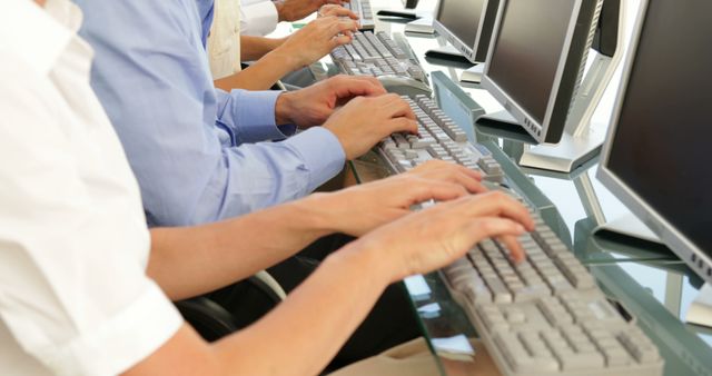 People Typing on Keyboards in Row at Workplace - Download Free Stock Images Pikwizard.com