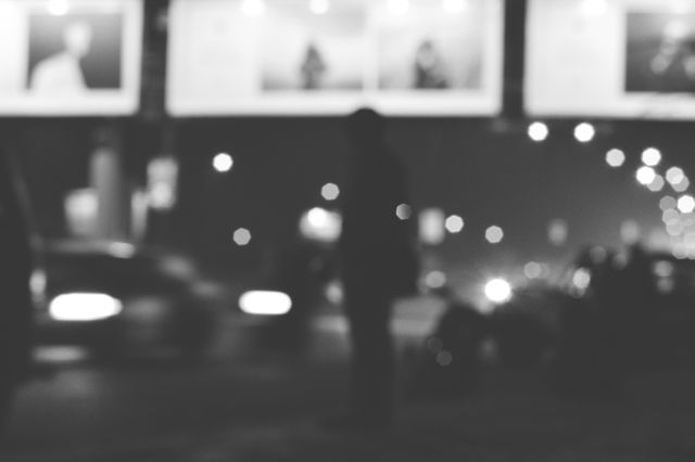 Silhouette of Person in Urban Night Scene with Blurred Lights - Download Free Stock Photos Pikwizard.com