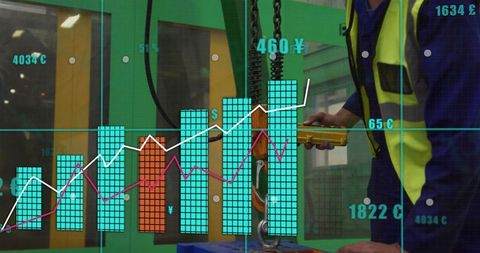 Factory worker using pendant control with overlay digital charts