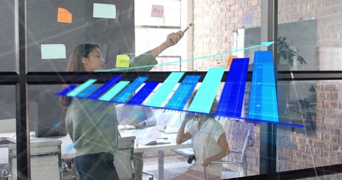 Diverse Team Collaborating on Digital Data Analytics in Modern Office