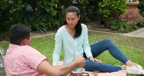 Young Couple Enjoying Picnic in the Park
