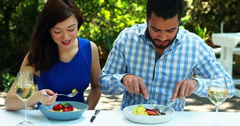 Couple Enjoying Outdoor Dining Experience in Daylight