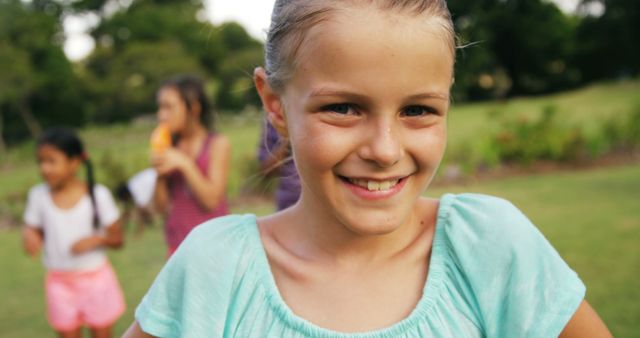 Smiling Girl Enjoying Outdoor Activities with Friends - Download Free Stock Images Pikwizard.com