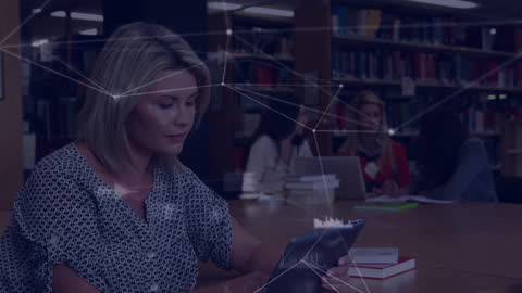 Businesswomen Embracing Technology in Collaborative Office Space