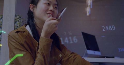 Businesswoman Using Smartphone with Digital Data Overlays