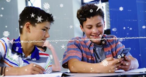 Two Boys Using Smartphone with Digital Snowflake Overlay in Classroom