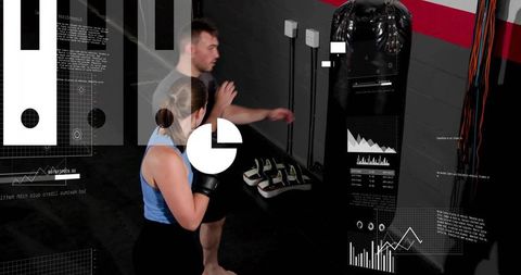 Coach guiding boxing trainee hitting heavy bag with digital hud performance overlays