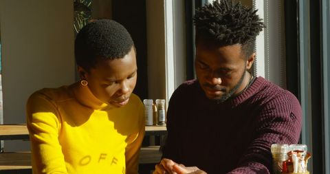 Thoughtful Discussion Between Professional African American Colleagues