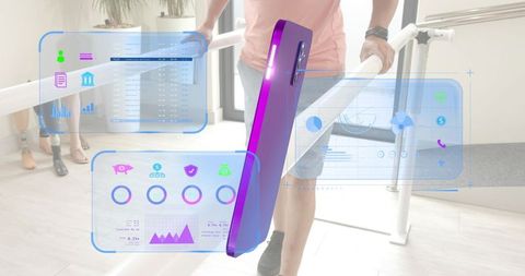 Patient walking on parallel bars during augmented gait therapy with holographic UI