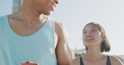 Joyful Couple Enjoying Beach as Summer Sun Sets
