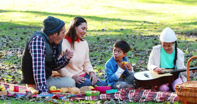 Family Enjoying Picnic Outdoors with Guitar and Food on a Sunny Day - Download Free Stock Images Pikwizard.com