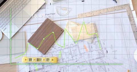 Blueprint with Tools and Graph Overlay On Architect's Desk