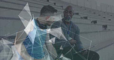 Coach Advising Athlete at Outdoor Stadium with Geometric Overlay