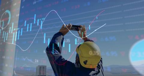 Industrial Worker Utilizing Technology with Financial Data Overlay