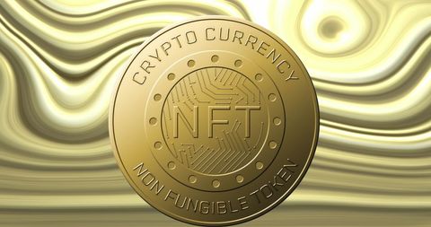 Shiny NFT Cryptocurrency Coin Against Abstract Gold Background