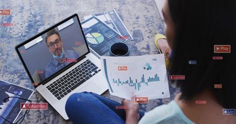 Remote worker reviewing charts during virtual meeting with laptop, graphs and overlays