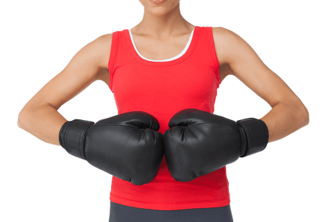 Determined female boxer with black boxing gloves on transparent background