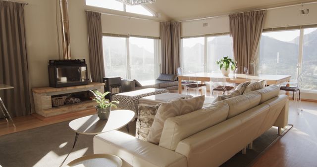 Furnished living room interior with large sunny windows, copy space. Lounge, home, interior design, luxury, domestic life and lifestyle, unaltered.