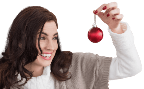 Smiling Woman Holding Red Christmas Ornament on Transparent Background