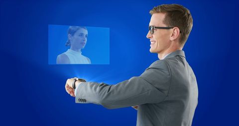 Businessman Interacting with Smartwatch Hologram Display - Download Free Stock Images Pikwizard.com