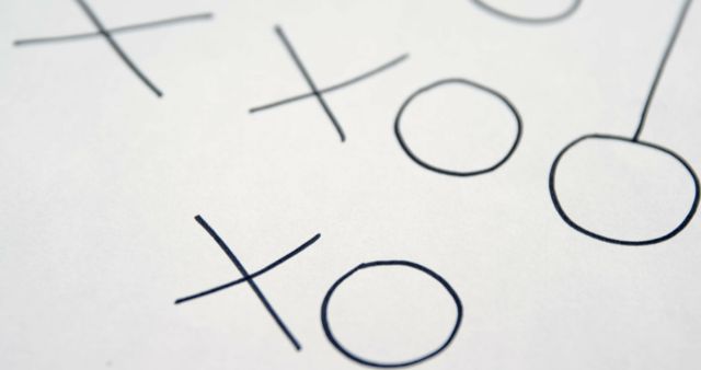 Close-up of Tic-Tac-Toe Game on White Paper - Download Free Stock Images Pikwizard.com