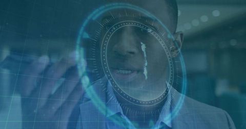 Pointing professional interacting with holographic circular interface in corporate office