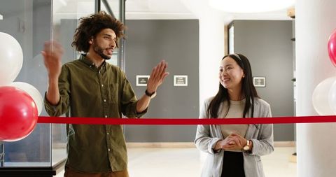 Business Leaders Discussing at Office Opening Celebration